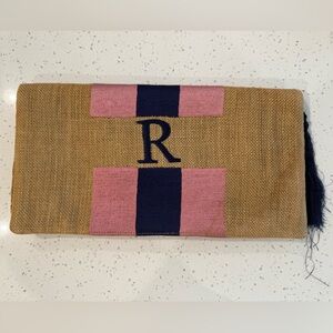 Moyna “R” Jute Stripe clutch with tassel